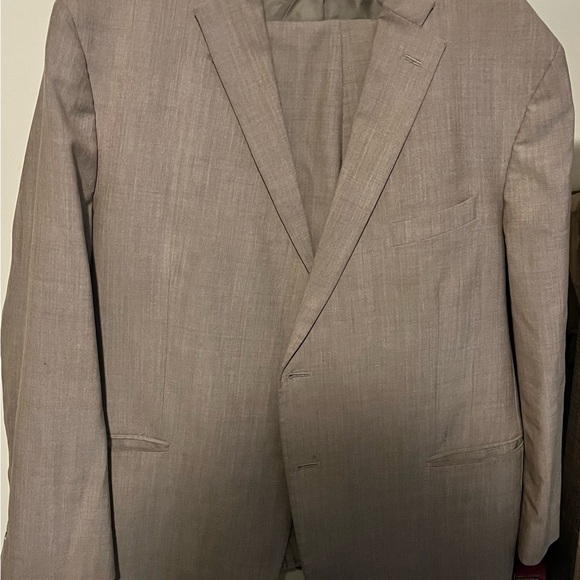 Two piece tan suit. Jacket -52 and pants-W:46 L: 30